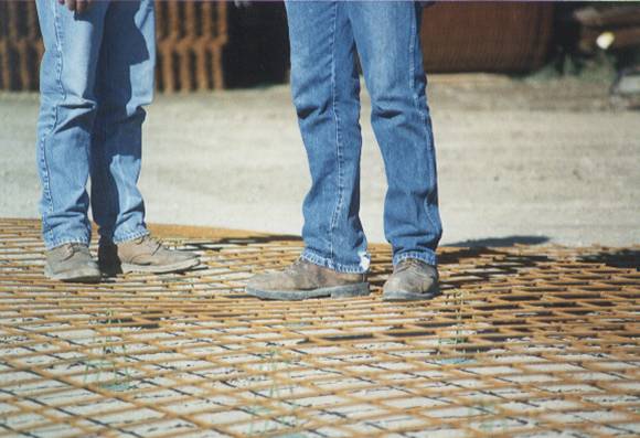 Standing on wire mesh bending it before concrete is poured